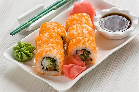 Japanese sushi with Masago, wasabi, soy sauce and ginger on white plate Fotografie stock - Microstock e Abbonamento, Codice: 400-09082687
