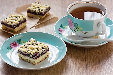 Homemade black currant crumble pie bars and cup tea Stock Photo - Budget Royalty-Free & Subscription, Code: 400-09082688