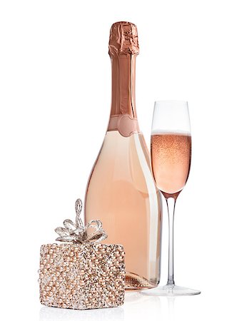 simsearch:400-04265369,k - Bottle and glass of pink rose champagne with christmas decoration and gift on white background Foto de stock - Super Valor sin royalties y Suscripción, Código: 400-09082853