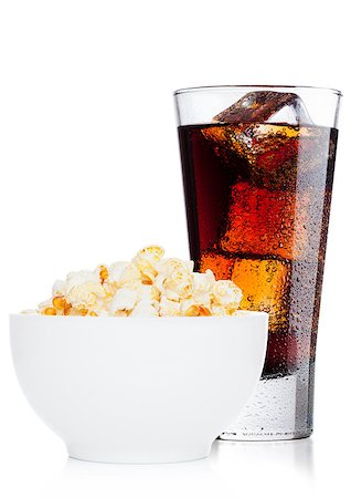 Popcorn salty sweet snack in white bowl with cola soda drink on white background Stock Photo - Budget Royalty-Free & Subscription, Code: 400-09082863
