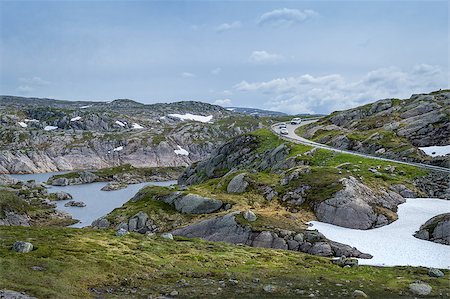 steffus (artist) - Scenic Norwegian landscape with rocks, lake and curved mountain road with some cars on it. Norway. Fotografie stock - Microstock e Abbonamento, Codice: 400-09094853