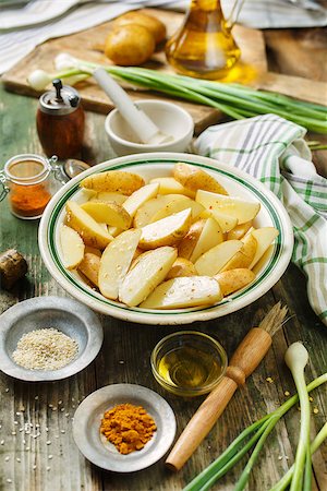 simsearch:400-06701002,k - Raw potatoes with spices and green onions, ingredients for cooking Stock Photo - Budget Royalty-Free & Subscription, Code: 400-09096481