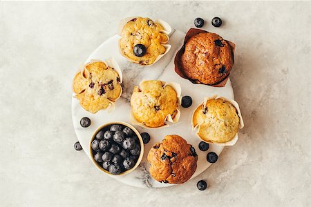 simsearch:400-08735386,k - Homemade muffins with blueberries. Top view. Grey stone background. Copy space. Foto de stock - Super Valor sin royalties y Suscripción, Código: 400-09097153