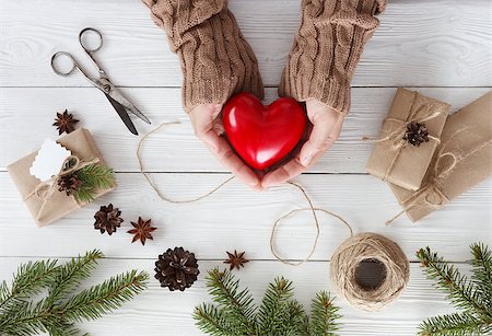 Preparation christmas gifts on a white wooden table with fir branches Stock Photo - Budget Royalty-Free & Subscription, Code: 400-09092125