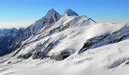 studio023 (artist) - high snowy mountain peaks and glaciers rocks with blue sky, freedom Stockbilder - Microstock & Abonnement, Bildnummer: 400-09108363