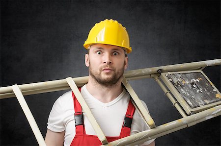 silly accident - Clumsy construction worker standing with a ladder Stock Photo - Budget Royalty-Free & Subscription, Code: 400-09119678