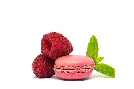Delicious pink french macaroons on white background with fresh raspberry and mint leaves. Stock Photo - Budget Royalty-Free & Subscription, Code: 400-09119942