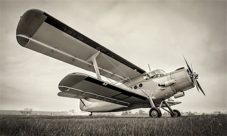 simsearch:400-09119906,k - sports plane on a meadow against a cloudy sky Stock Photo - Budget Royalty-Free & Subscription, Code: 400-09119974