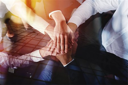 simsearch:400-04390114,k - Business people joining hands in a circle in the office. concept of teamwork and partnership. double exposure Photographie de stock - Aubaine LD & Abonnement, Code: 400-09112268