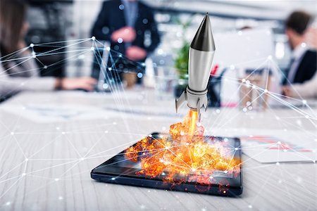 simsearch:400-09112433,k - Fast rocket ready to starts from a tablet. concept of company startup Stockbilder - Microstock & Abonnement, Bildnummer: 400-09112435