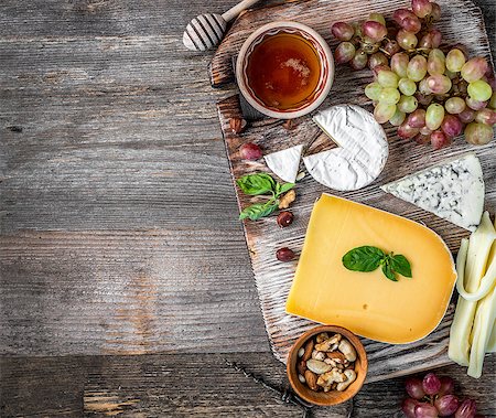 simsearch:400-05682309,k - Cheese plate served with wine, nuts and honey top view. space for text Stock Photo - Budget Royalty-Free & Subscription, Code: 400-09112455