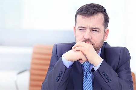 Tired business man at workplace in office holding his head on hands. Sleepy worker early in the morning after late night work. Stock Photo - Budget Royalty-Free & Subscription, Code: 400-09120042