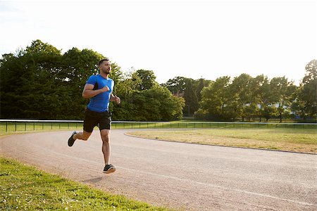 simsearch:632-06118219,k - Young male athlete running at a track, full length Stock Photo - Budget Royalty-Free & Subscription, Code: 400-09121813