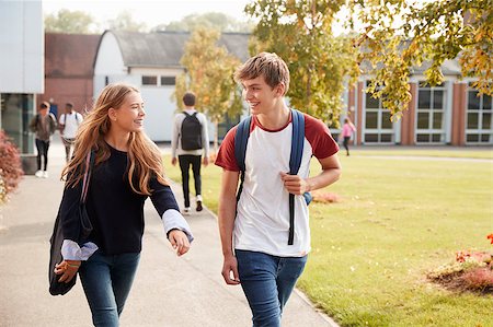 simsearch:400-09122044,k - Teenage Students Walking Around College Campus Together Stock Photo - Budget Royalty-Free & Subscription, Code: 400-09121934