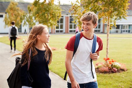 simsearch:400-09122044,k - Teenage Students Walking Around College Campus Together Stock Photo - Budget Royalty-Free & Subscription, Code: 400-09121933