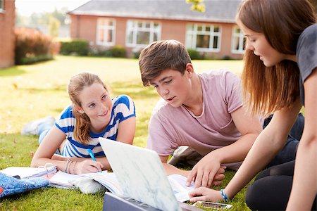 Teenage Students Sitting Outdoors And Working On Project Stock Photo - Budget Royalty-Free & Subscription, Code: 400-09121948