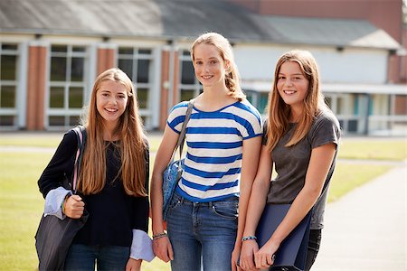 simsearch:400-09122044,k - Group Of Female Teenage Students Walking Around College Campus Stock Photo - Budget Royalty-Free & Subscription, Code: 400-09121942