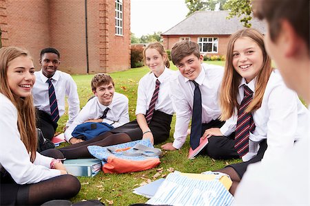 Teenage Students In Uniform Working On Project Outdoors Stock Photo - Budget Royalty-Free & Subscription, Code: 400-09121950