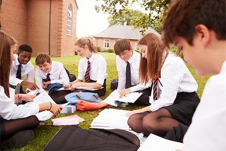 Teenage Students In Uniform Working On Project Outdoors Stock Photo - Budget Royalty-Free & Subscription, Code: 400-09121951
