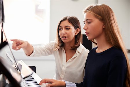 piano class - Female Pupil With Teacher Playing Piano In Music Lesson Stock Photo - Budget Royalty-Free & Subscription, Code: 400-09121985