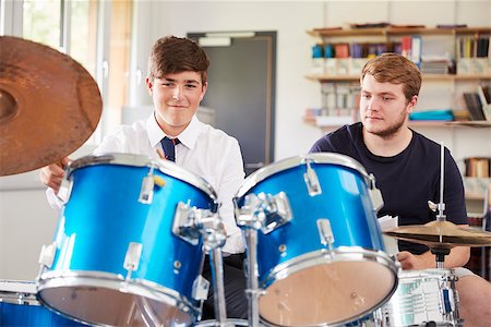 simsearch:400-09121964,k - Male Pupil With Teacher Playing Drums In Music Lesson Stock Photo - Budget Royalty-Free & Subscription, Code: 400-09121982