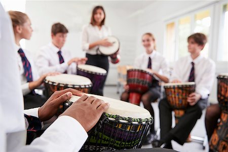 simsearch:400-09121991,k - Teenage Students Studying Percussion In Music Class Fotografie stock - Microstock e Abbonamento, Codice: 400-09121996