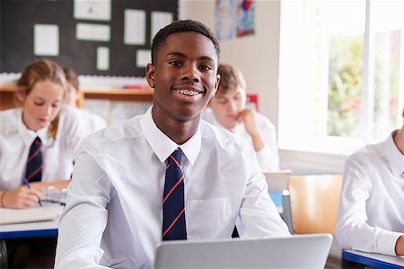 simsearch:400-09121964,k - Portrait Of Male Pupil In Uniform Using Laptop In Classroom Stock Photo - Budget Royalty-Free & Subscription, Code: 400-09122009