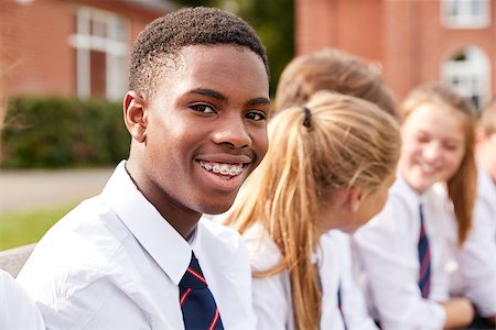 simsearch:400-09122044,k - Portrait Of Teenage Students In Uniform Outside School Buildings Stock Photo - Budget Royalty-Free & Subscription, Code: 400-09122017