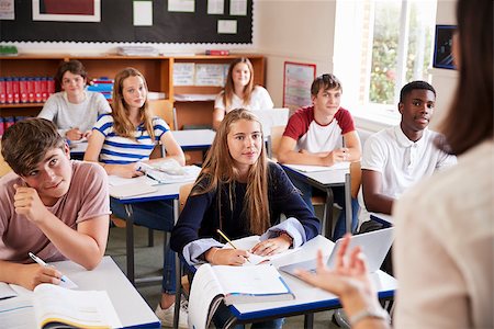 simsearch:400-09121964,k - Students Listening To Female Teacher In Classroom Stock Photo - Budget Royalty-Free & Subscription, Code: 400-09122024