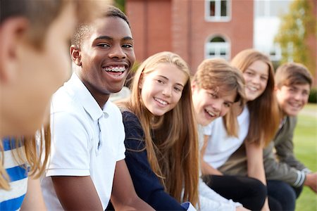 simsearch:400-09122044,k - Group Of Teenage Students Sitting Outside School Buildings Stock Photo - Budget Royalty-Free & Subscription, Code: 400-09122034