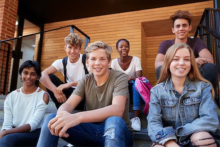 simsearch:400-09122044,k - Group Of Teenage Students Socialising On College Campus Together Stock Photo - Budget Royalty-Free & Subscription, Code: 400-09122036