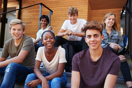 simsearch:400-09122044,k - Group Of Teenage Students Socialising On College Campus Together Stock Photo - Budget Royalty-Free & Subscription, Code: 400-09122038