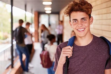 Portrait Of Male Teenage Student On College With Friends Stock Photo - Budget Royalty-Free & Subscription, Code: 400-09122048