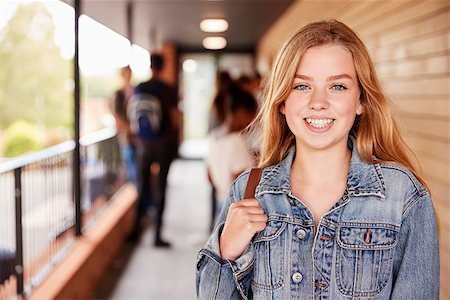 Portrait Of Female Teenage Student On College With Friends Stock Photo - Budget Royalty-Free & Subscription, Code: 400-09122051