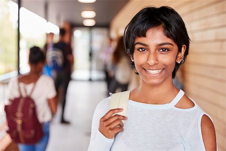 Portrait Of Female Teenage Student On College With Friends Stock Photo - Budget Royalty-Free & Subscription, Code: 400-09122053