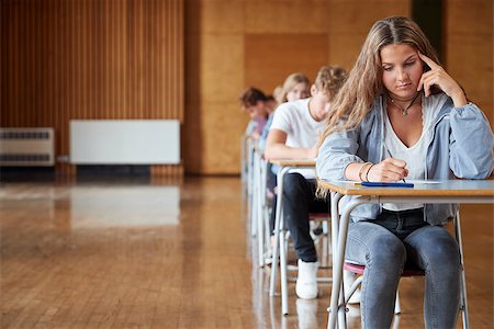 Group Of Teenage Students Sitting Examination In School Hall Stock Photo - Budget Royalty-Free & Subscription, Code: 400-09122085