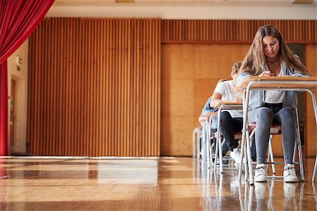 Group Of Teenage Students Sitting Examination In School Hall Stock Photo - Budget Royalty-Free & Subscription, Code: 400-09122087