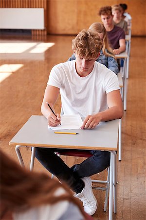 Group Of Teenage Students Sitting Examination In School Hall Stock Photo - Budget Royalty-Free & Subscription, Code: 400-09122094