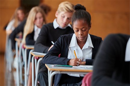 Teenage Students In Uniform Sitting Examination In School Hall Stock Photo - Budget Royalty-Free & Subscription, Code: 400-09122098