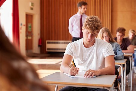 simsearch:400-09122044,k - Teenage Students Sitting Examination With Teacher Invigilating Stock Photo - Budget Royalty-Free & Subscription, Code: 400-09122091