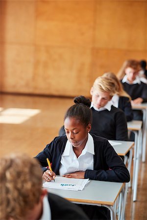 Teenage Students In Uniform Sitting Examination In School Hall Stock Photo - Budget Royalty-Free & Subscription, Code: 400-09122104