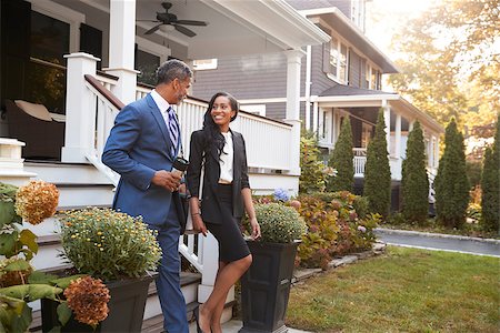 Business Couple Leaving Suburban House For Commute To Work Stock Photo - Budget Royalty-Free & Subscription, Code: 400-09122144