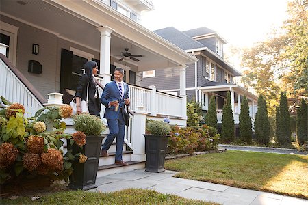Business Couple Leaving Suburban House For Commute To Work Stock Photo - Budget Royalty-Free & Subscription, Code: 400-09122146