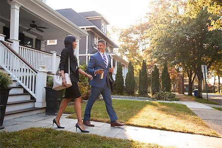 Business Couple Leaving Suburban House For Commute To Work Stock Photo - Budget Royalty-Free & Subscription, Code: 400-09122147