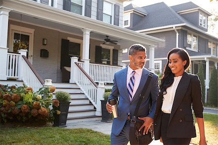 Business Couple Leaving Suburban House For Commute To Work Stock Photo - Budget Royalty-Free & Subscription, Code: 400-09122148