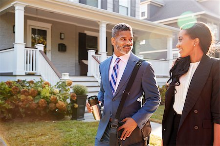 Business Couple Leaving Suburban House For Commute To Work Stock Photo - Budget Royalty-Free & Subscription, Code: 400-09122149