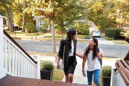 Business Couple Leaving Suburban House For Commute To Work Stock Photo - Budget Royalty-Free & Subscription, Code: 400-09122143