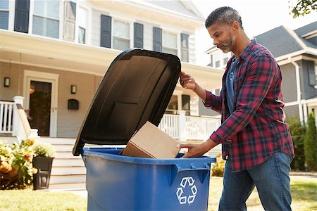 recycle bins for the home - Man Filling Recycling Bin On Suburban Street Stock Photo - Budget Royalty-Free & Subscription, Code: 400-09122174