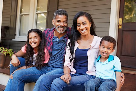 simsearch:400-09122233,k - Family With Children Sit On Steps Leading Up To Porch Of Home Stock Photo - Budget Royalty-Free & Subscription, Code: 400-09122198