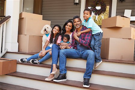 Family With Children And Pet Dog Outside House On Moving Day Stock Photo - Budget Royalty-Free & Subscription, Code: 400-09122210